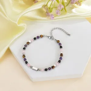 Detailansicht von 4mm Tigerauge und Amethyst Perlenarmband mit Edelstahlleiste.