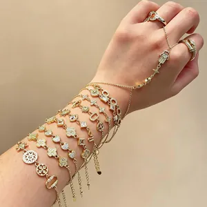 Gold adjustable charm bracelets and rings set for women's stylish layered jewelry look