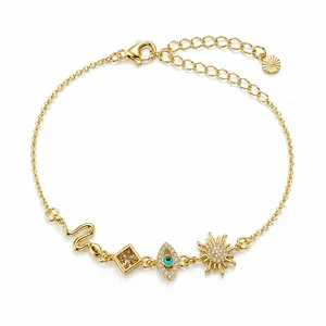 Gold-toned adjustable bracelet with snake, evil eye, and sun charms and rhinestones