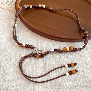 Bohemian vintage beaded waist chain with wooden beads and brown cord for dresses
