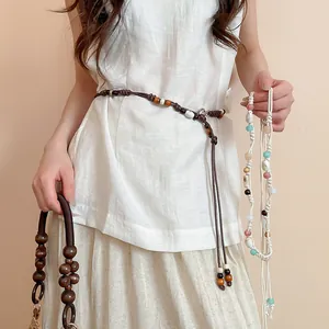 Detail view of handmade bohemian beaded waist chain with ethnic style accents