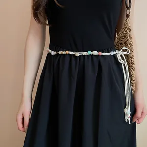 Detail view of a bohemian beaded waist chain with a retro ethnic style design