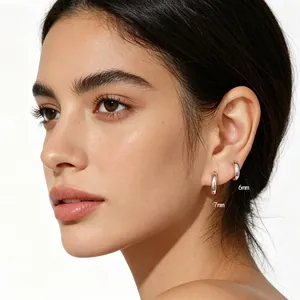 Detail view of minimalist S925 sterling silver hoop earrings in 6mm and 7mm sizes