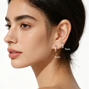 Minimalist S925 silver hoop earrings with 7mm and 8mm sizes displayed on the ear lobe.