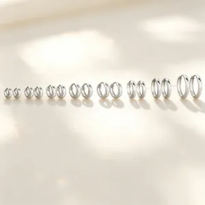 Detailed view of S925 sterling silver hoop earrings in various sizes with polished finish