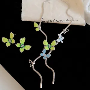 Vintage style enamel butterfly necklace and earrings set with delicate rhinestone accents