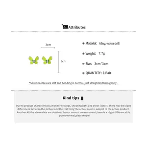 Detailed view of green butterfly earrings with material and size specifications