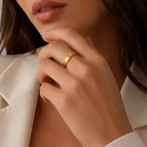 Macro view of a gold-plated stainless steel ring with sun pattern engraving