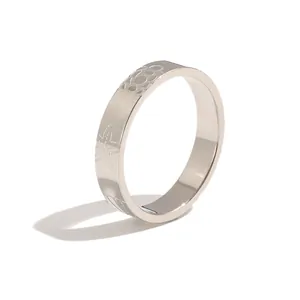 Minimalist stainless steel ring featuring engraved ocean motifs like starfish and shells