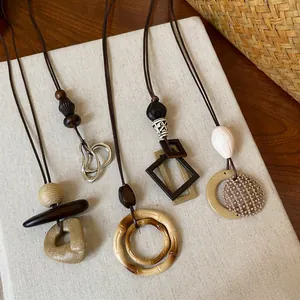 Set of 4 handmade resin geometric pendant necklaces with artistic wooden-style accents