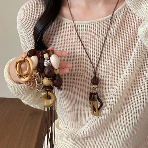 Bohemian geometric resin pendant necklace with wooden beads for summer style outfits