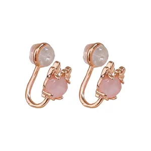 Elegant rose gold clip-on earrings with pink oval cat's eye stones and soft pads