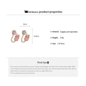 Detailed product specifications showing material and size of pink cat's eye stone ear clips.