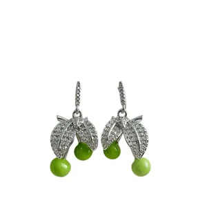Elegant silver cherry drop earrings featuring zircon leaves and green enamel fruit
