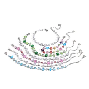 Close-up of colorful crystal stainless steel bracelets with various gem cuts.