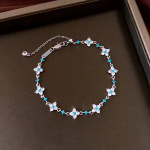 Elegant 18k gold plated flower bracelet with shimmering zircons and turquoise beads
