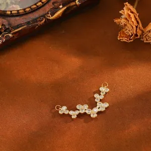 Elegant gold-plated copper pendant connector featuring clear cubic zirconia stone clusters.