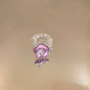 Close-up detail of the purple resin flower and clear glass beaded elastic ring structure