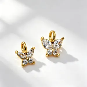 Detailed view of zircon-studded butterfly charms in 14K gold-plated stainless steel