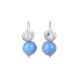 Elegant blue gummy sphere drop earrings with silver flower detail on white background