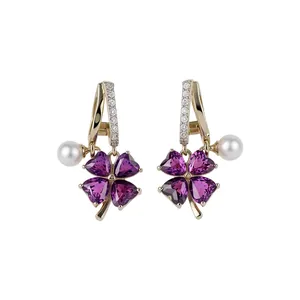 Elegant purple four-leaf clover flower earrings with white pearls and sparkling crystals