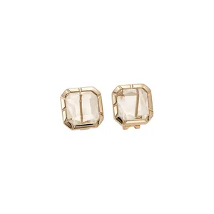 Elegant luxury square crystal stud earrings with gold plating on a clean white background