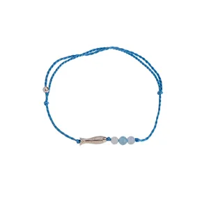 Handmade braided blue cord bracelet with silver fish charm and light blue beads.