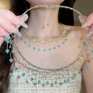 Close-up of elegant fringe choker with light blue crystal beads and tassels