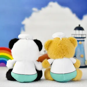 Back view of plush panda and bear keychain charms in medical outfits