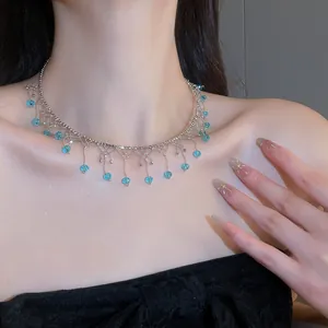 Close-up view of an elegant crystal lace tassel choker necklace on a model's neck
