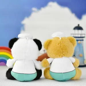 Rear view of plush doctor panda and bear toys in white medical scrubs and green pants
