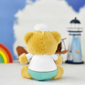Back view of a doctor bear plush keychain wearing a white uniform and hat