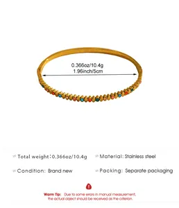 Golden stainless steel bangle with colorful rhinestones and product dimension details