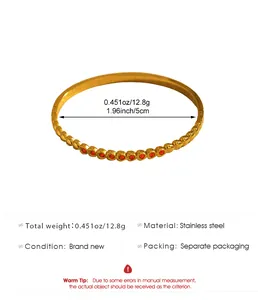 Detail showing dimensions and weight of golden bohemian stainless steel bangle.