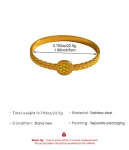 Vintage gold stainless steel bohemian bangle with leaf patterns and yellow rhinestones