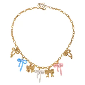 Detail of gold-tone necklace featuring colorful enamel bow pendants for sweet style.