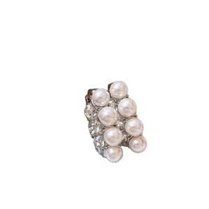 Elegant French C-shaped earrings with white pearls and sparkling cubic zirconia stones