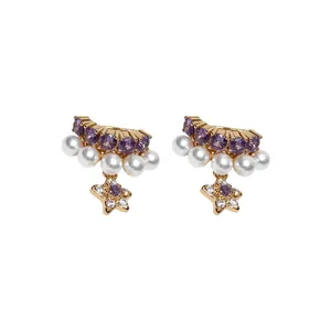 Elegant gold-tone ear cuffs featuring purple zircons, white pearls and star pendants