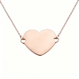 Detailed macro view of a rose gold mirror finish stainless steel heart pendant necklace