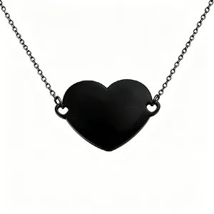 Close-up detail of the black stainless steel heart-shaped necklace pendant.