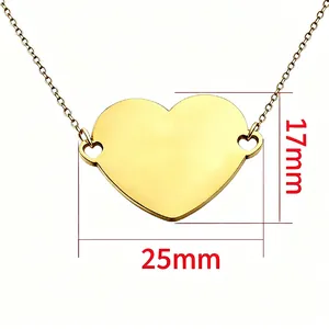 Macro detail view showing the 25mm by 17mm dimensions of this gold heart pendant necklace