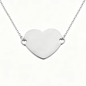 Close-up view of a mirror polished stainless steel heart pendant for DIY laser engraving