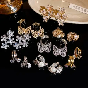 Sparkly zircon butterfly and flower ear clips for non-pierced ears in various styles.