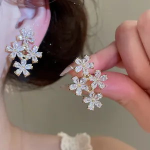Close-up of sparkling zircon flower clip-on earrings for non-pierced ears in detail