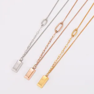 Detailed view of three gold bar pendant necklaces in silver, rose gold and gold