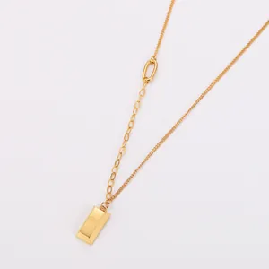 Detailed shot of 18k gold plated stainless steel necklace with gold bar pendant