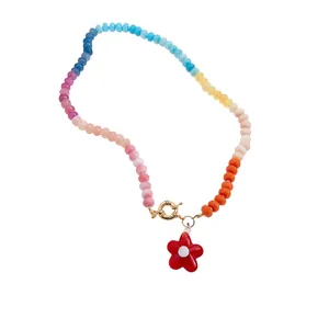 Vibrant summer crystal beaded necklace featuring a cute red flower pendant design