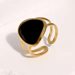 Close-up of geometric black enamel detail on 18K gold-plated stainless steel ring