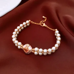 Elegantes doppellagiges Perlenarmband mit orangefarbenem Zirkon und Perlmutt-Inlay
