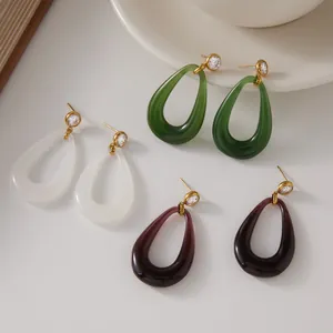 Teardrop resin earrings in green, white and purple with gold titanium steel studs